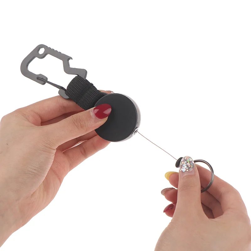 Retractable key holder with carabiner